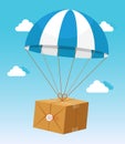 Blue and White Parachute Holding Delivery Box Royalty Free Stock Photo