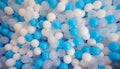 Blue and white plastic balls in ball pool at kids playground. Colorful plastic ball texture background. Many small colorful hollow