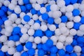 Blue and white plastic balls in ball pool at kids playground. Colorful plastic ball texture background. Many small Royalty Free Stock Photo