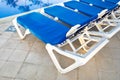 Blue and white plastic lounges Royalty Free Stock Photo