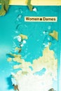 Blue and white poster with the words Women Dames written on it Royalty Free Stock Photo