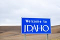 Blue and white road sign with Welcome to Idaho text Royalty Free Stock Photo