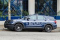 Blue and white Seattle police car parked on street