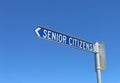 Blue and white senior citizens sign pointing Royalty Free Stock Photo