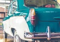 Blue and white shiny retro vintage car rear view Royalty Free Stock Photo