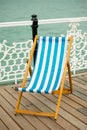 Deck chair on Brighton pier promenade. Royalty Free Stock Photo