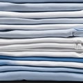 Blue and white T-shirts lie in a stack Royalty Free Stock Photo