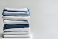 Blue and white T-shirts lie in a stack Royalty Free Stock Photo