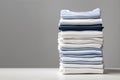 Blue and white T-shirts lie in a stack Royalty Free Stock Photo