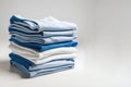 Blue and white T-shirts lie in a stack. Illustration with place for text Royalty Free Stock Photo