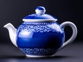A blue and white teapot sitting on top of a table Royalty Free Stock Photo