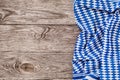 Blue - white textile napkin on the right side of a wooden table. Layout for food background Royalty Free Stock Photo