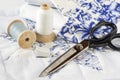 Blue and white thread and scissors