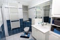 Blue white tiled bathroom with toilet