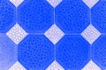 Deep blue and white tiles background with octagons and rhomb pattern. Geometric abstract background