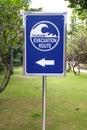 A Blue and White Tsunami Evacuation Route Sign at a hotel in Kuta, Bali, Indonesia