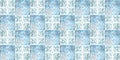 Blue white vintage worn retro geometric motif cement square mosaic tiles wallpaper with flower leaves print texture background Royalty Free Stock Photo