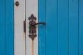 Blue and white door with old doorhandle Royalty Free Stock Photo