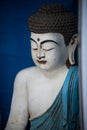blue and white wooden statue of buddha in a store showroom Royalty Free Stock Photo
