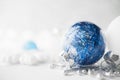 Blue and white xmas ornaments on glitter holiday background. Merry christmas card. Royalty Free Stock Photo