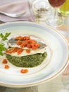 Blue whiting fillets with spinach and tomatoes