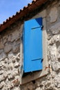 Blue window in the ancient town Lubenice, island Cres, Croatia