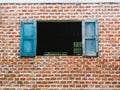 Blue window on brick wall Royalty Free Stock Photo