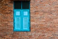 Blue window on the floor old red brick wall texture Royalty Free Stock Photo