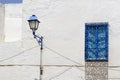 Blue window and lamp on house in Tunisia Royalty Free Stock Photo