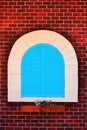 Blue window and old red brick wall vintage style,door with design arch on wall and backdrop Royalty Free Stock Photo