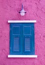 Blue window on pink wall Royalty Free Stock Photo