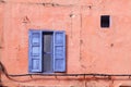 Blue window on the pink wall. Royalty Free Stock Photo