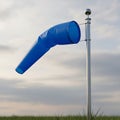 Blue windsock on a pole indicating wind direction Royalty Free Stock Photo
