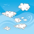 Blue windy sky with swirly clouds and birds Royalty Free Stock Photo