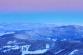 Blue winter landscape, birch tree forest with snow, ice and rime. Pink morning light before sunrise. Winter twilight, cold nature Royalty Free Stock Photo