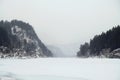 Blue winter mountain misty river. Snow frozen pine trees Idyllic landscape. Travel day Frost winter season Royalty Free Stock Photo