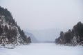 Blue winter mountain misty river. Snow frozen pine trees Idyllic landscape. Winter mountains natural view, sky, forest . Travel Royalty Free Stock Photo