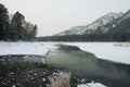 Blue winter mountain misty river. Snow frozen pine trees Idyllic landscape. Winter mountains natural view, sky, forest . Travel