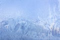 Blue winter pattern on window glass. Frosty background Royalty Free Stock Photo