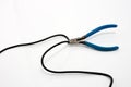 Blue Wire cutter cutting wire