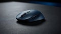 A blue wireless computer mouse on a dark surface in a close up shot Royalty Free Stock Photo