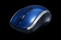 Blue wireless computer mouse with silver accents on black background Royalty Free Stock Photo