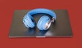 Blue wireless head on laptop top - music concept