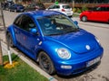 Blue Wolkswagen Beetle close up shot on the street.