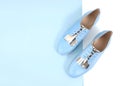 Blue women`s leather shoes with laces top view empty space backg Royalty Free Stock Photo