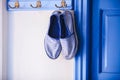 Blue women's slippers in Greek style of house on Royalty Free Stock Photo