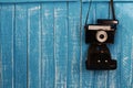 Blue wood backdrop background and vintage camera Royalty Free Stock Photo