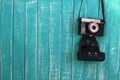 Blue wood backdrop background and vintage camera Royalty Free Stock Photo