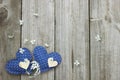 Blue and wood hearts with spring blossoms border wooden fence