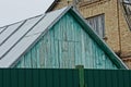 A blue wooden attic under a gray metal roof Royalty Free Stock Photo